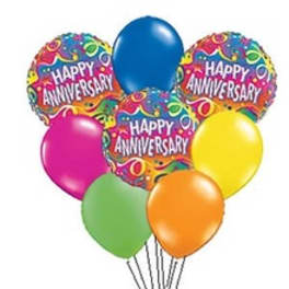 Cluster of colorful anniversary balloons with two printed foil balloons