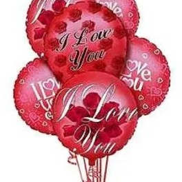 Cluster of red heart-shaped balloons with love messages