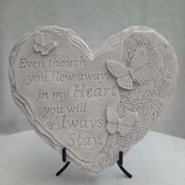 Heart-shaped memorial plaque with butterflies and floral relief