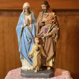Religious figurine of three saints on a small base