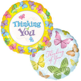 Two round butterfly-themed balloons with "Thinking of You" text