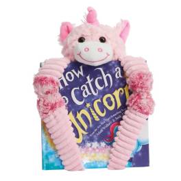 Pink unicorn plush holding a book-shaped gift