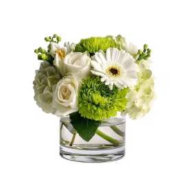 White and green flower arrangement in a clear glass vase