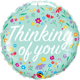 Round mint-green balloon with floral pattern and the words "Thinking of you"
