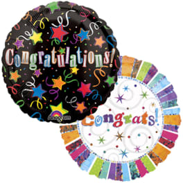 Two round congratulatory balloons with colorful confetti designs