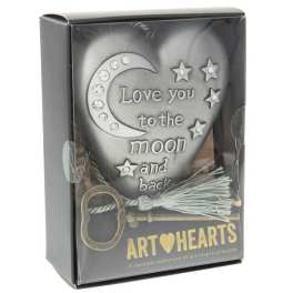 Decorative heart-shaped gift box with moon and star accents and the words "Love you to the moon and back"