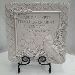 Decorative plaque with a cardinal and floral relief around a sympathy message