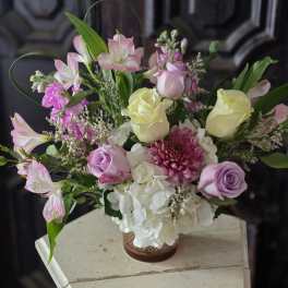Pink and white mixed bouquet in a copper vase