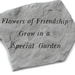 Stone plaque with the words "Flowers of Friendship" and "Grow in a Special Garden"