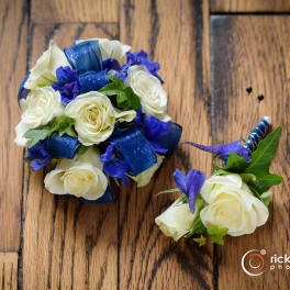 White rose bouquet and matching boutonniere with blue ribbon accents