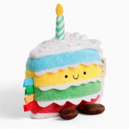 Plush slice of cake with a striped candle on top