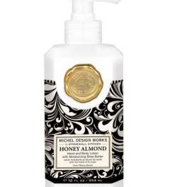 Bottle of honey almond hand and body lotion with a pump dispenser