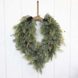 Heart-shaped evergreen wreath with pinecones and rope hanger