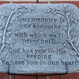 Memorial plaque with a leaf border and engraved remembrance text