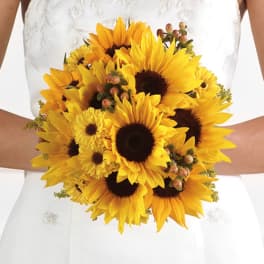 Bride holding a bouquet of yellow sunflowers and small yellow blooms