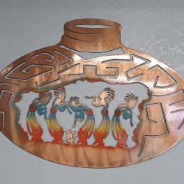 Copper-toned decorative wall plaque with cutout figures