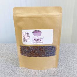 Kraft pouch of lavender tea with a clear window showing dried lavender buds