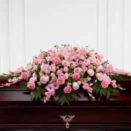 Pink floral casket spray with roses and carnations