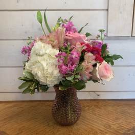 Pink and white mixed bouquet in a textured glass vase