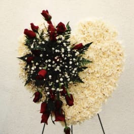 Red roses and white baby's breath on a standing spray
