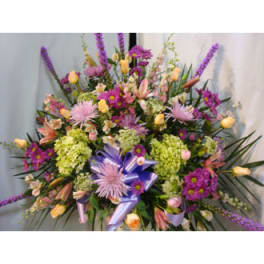 Large mixed bouquet with purple, pink, and yellow flowers