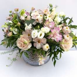 Blush and white mixed bouquet in a silver vase