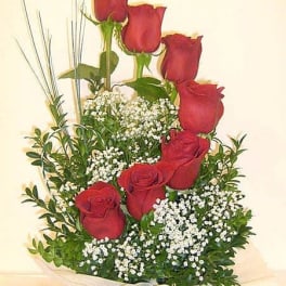 Bouquet of red roses with baby's breath and greenery