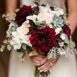 Bridal bouquet of burgundy, white, and blush flowers