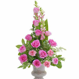 Pink roses and carnations in a gray vase