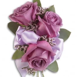 Small bouquet of lavender roses with satin ribbon and greenery
