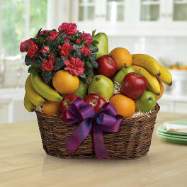 Fruit basket with flowers and a purple ribbon