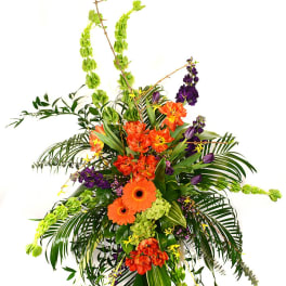 Tall tropical floral spray with orange and purple flowers