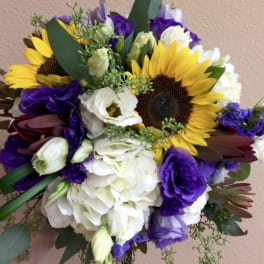 Bouquet of sunflowers, white blooms, and purple flowers