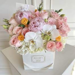 Pink and white flower bouquet in a white gift box