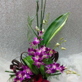 Tall bouquet with purple orchids and red roses