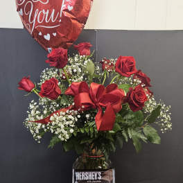 Red rose bouquet with a heart balloon, chocolates, and a candle