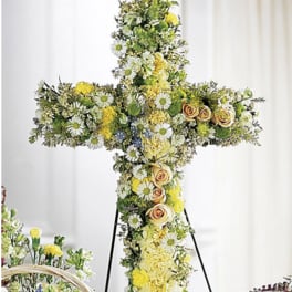 Cross-shaped floral standing spray with yellow and white flowers