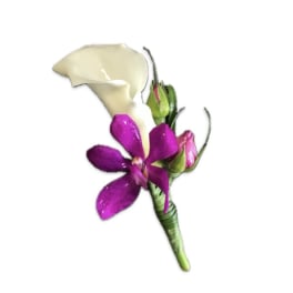 Wedding boutonniere with white calla lily, purple orchid, and pink rosebud on a wrapped green stem