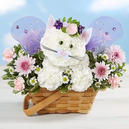 Cat-shaped floral basket with pink and white flowers and butterfly wings