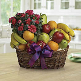 Fruit basket with flowers and a purple ribbon