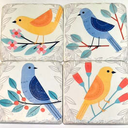 Four decorative bird tiles with floral branch patterns