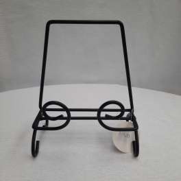 Black metal display stand with a price tag