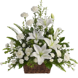 White lilies and carnations in a wicker basket
