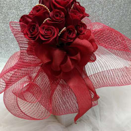 Bouquet of red roses with a large red ribbon bow