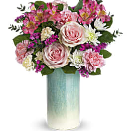 Tall pink and white mixed flower arrangement in a blue ombre cylinder vase