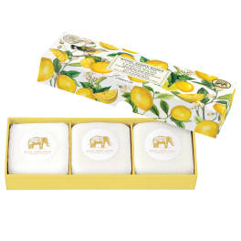 Three wrapped soap bars in a lemon-patterned gift box