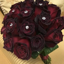 Bouquet of dark red roses with jeweled centers