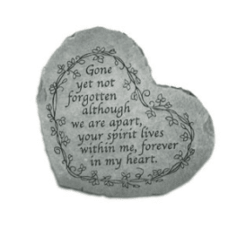 Heart-shaped memorial stone with an engraved remembrance message