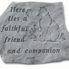 Engraved stone plaque with a cat and the words 'Here lies a faithful friend and companion'