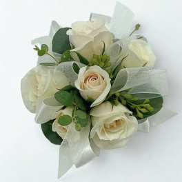 White rose bouquet with silver ribbon and greenery